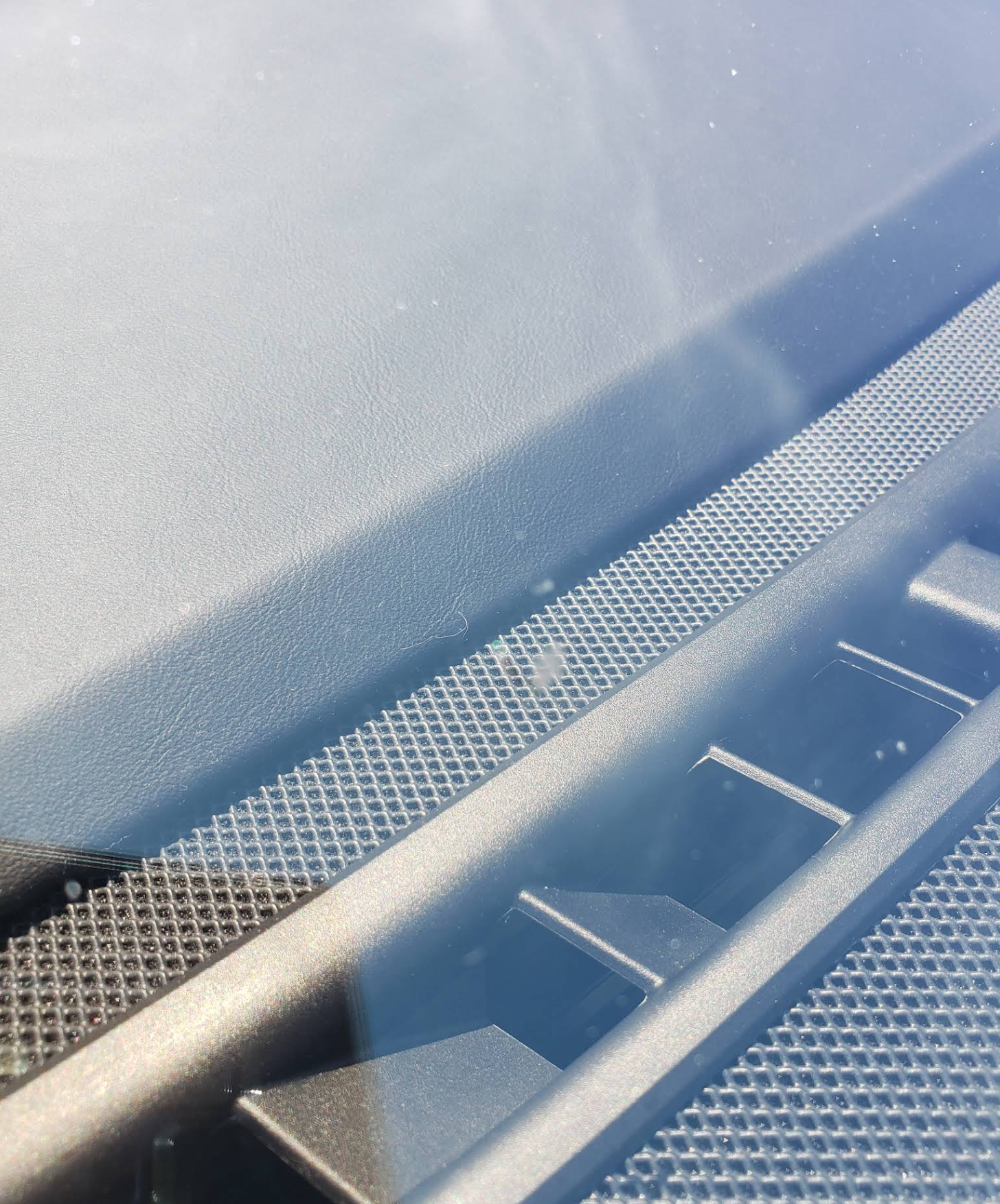 Clean windshield after rock chip repair